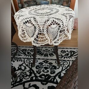 Vintage homemade crocheted cream colored round table cloth.
